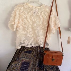 Cream/ivory ruffle detail crew neck short sleeve sheer top